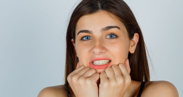 why do my bottom teeth feel tight