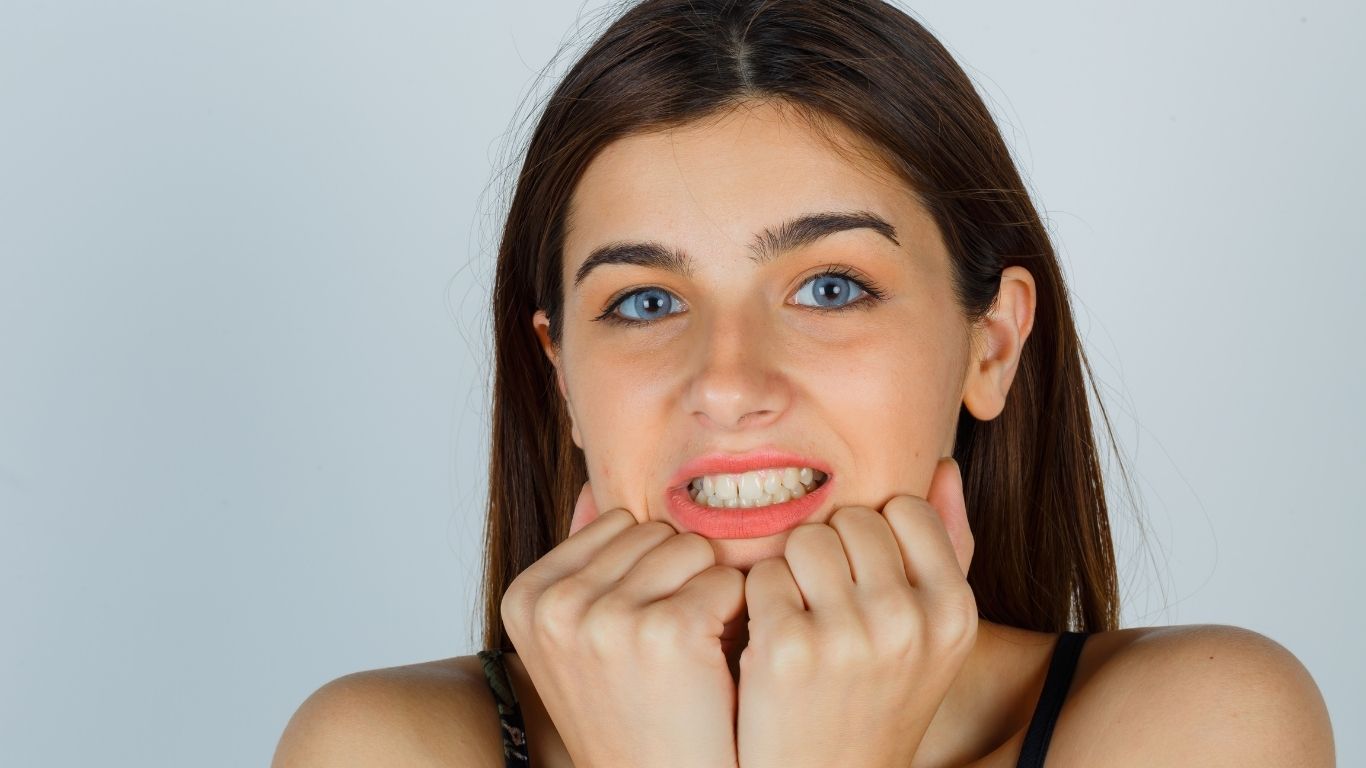 why do my bottom teeth feel tight